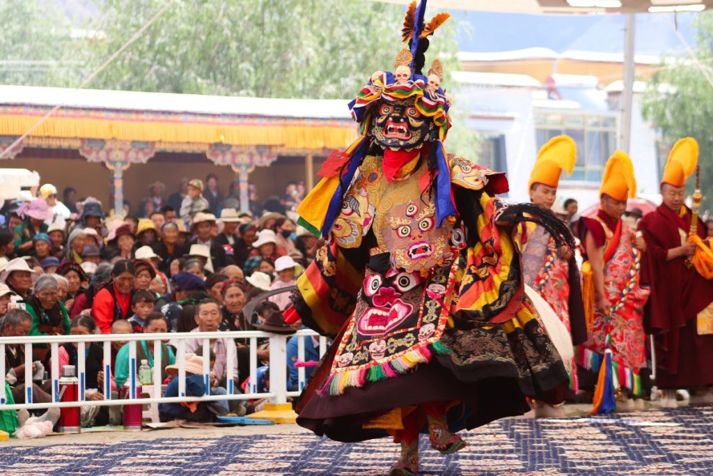 Tibetans watching the Cham Dance